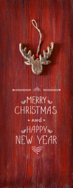 Natal cartão greeteng com rena . Imagem De Stock