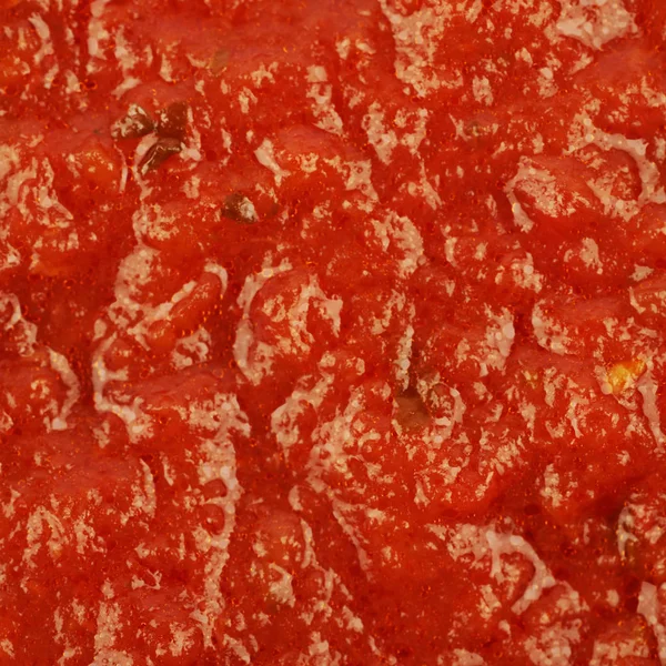 Surface coated with tomato sauce — Stock Photo, Image