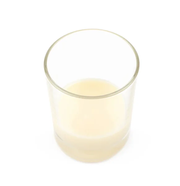 Gecondenseerde melk in een geïsoleerd glas — Stockfoto