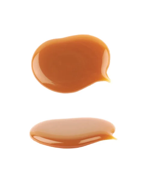Splash of caramel sauce isolated — Stock Photo, Image