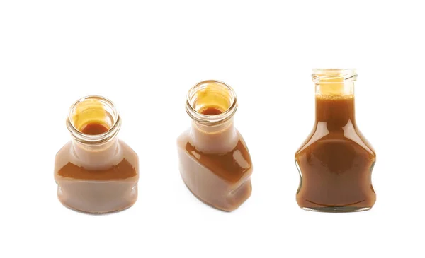 Bottle of caramel sauce isolated Stock Picture