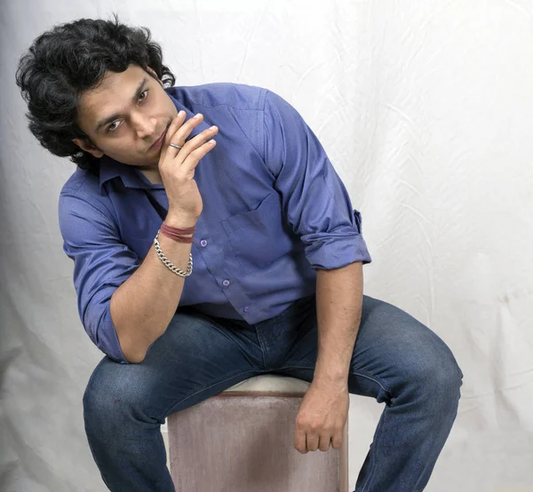 indian male model posing in anger in blue shirt