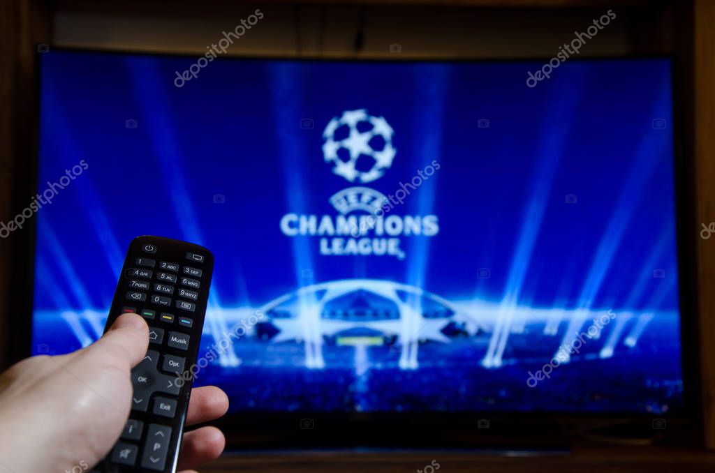 Soest, Germany - January 14, 2018: Man watching UEFA Champions League on TV. The UEFA Champions League is an annual continental club football competition.