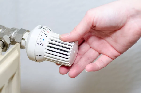 Close Hand Adjusting Heating Thermostat — Stock Photo, Image