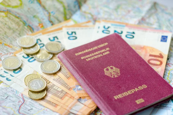 German passport with money on the map.