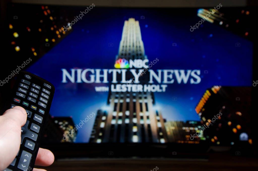 Soest, Germany - January 13, 2019: Man watching NBC Nightly News with Lester Holt on TV.