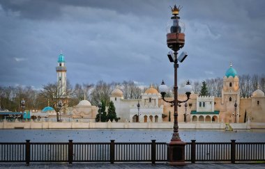 View of lake and arabic attraction building Fata Morgana at theme park the Efteling clipart