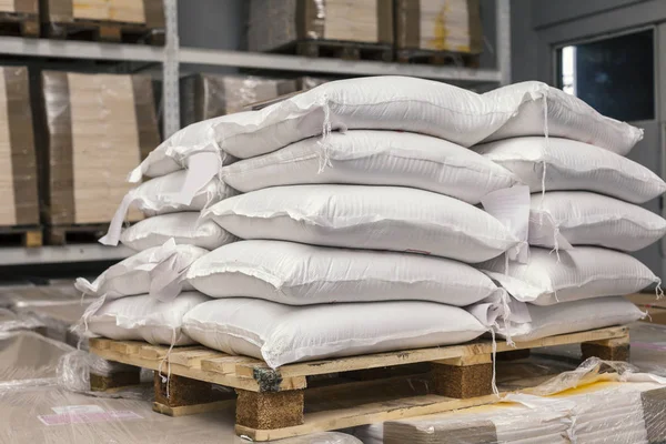 sacks of flour on pallets in warehous