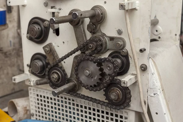 chains and sprockets on the old machine, close up