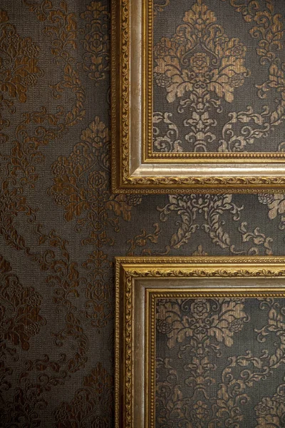 Gold vintage frame on wall — Stock Photo, Image