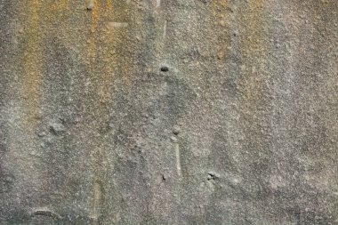 Grunge tarzında sarı ve bej lekeli pürüzlü gri doku