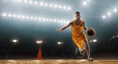Professional basketball player dribbles a ball clipart