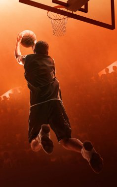 Basketbolcu sayı yapıyor. Smaç. Kırmızı ışıklandırılmış backgroound