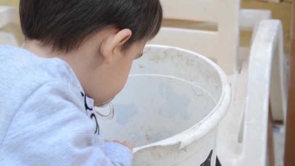 Cute Two Years Old Boy Playing Dirt White Bucket — Stock Video