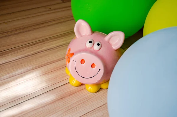 cute pink piggy bank and ballons