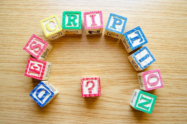 Educational toy cubes with letters organised to display word DESCRIPTION - editing metadata and Search engine optimisation concept