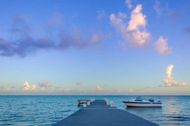 Pier at sunset on the Caribbean Sea in the South Sound area, Grand Cayman, Cayman Islands clipart