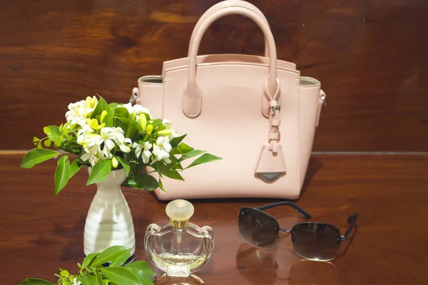 pink handbag collection colorful fashion for lifestyle woman relax and accessories on background wooden