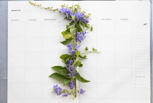 notebook planner monthly with purple flowers on background white