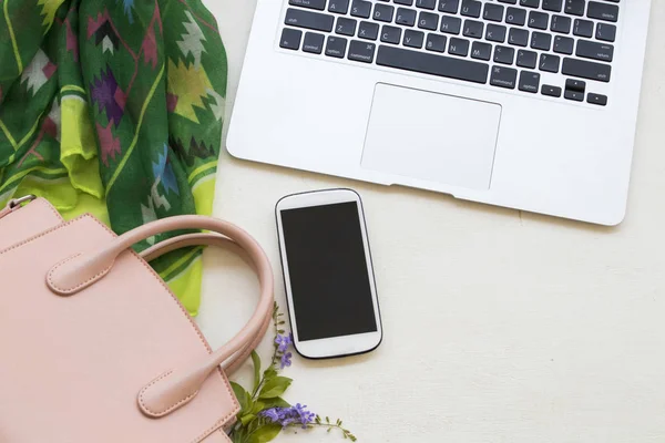 mobile phone  with computer  equipment for business work and pink hand bag ,green scarf of lifestyle woman at office desk on background white