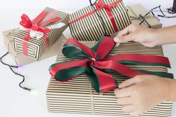 hand of girl holding gift box for special in christmas and new year festival day on background white