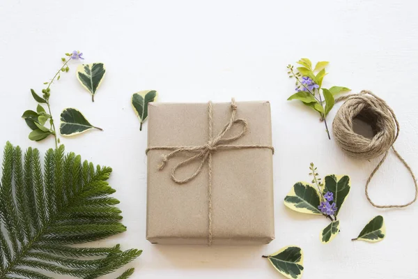 gift box for special in christmas and new year festival day with string ,leaf  on background white