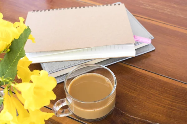 notebook planner  for business work with hot coffee at office desk