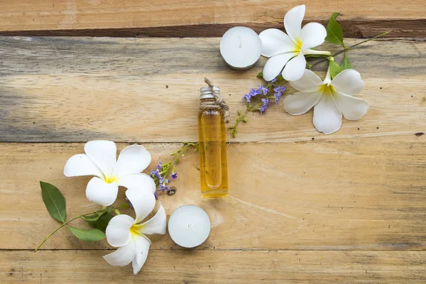 natural herbal oils extract from flower frangipani  local of asia arrangement flat lay style on background wooden