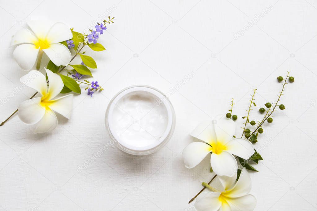 natural medication herbal cream health care acne skin face with white flower frangipani arrangement flat lay on background white 