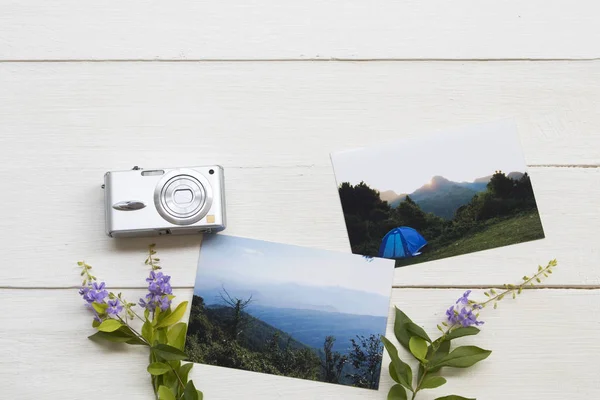 photograph for memory with compact camera of lifestyle picture relax travel arrangement flat lay postcard style on background white wooden