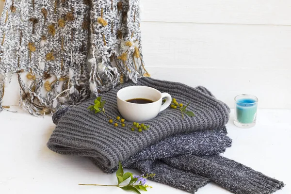 scarf ,sweater knitting wool ,hot coffee of lifestyle woman relax in winter season decoration on background white wooden