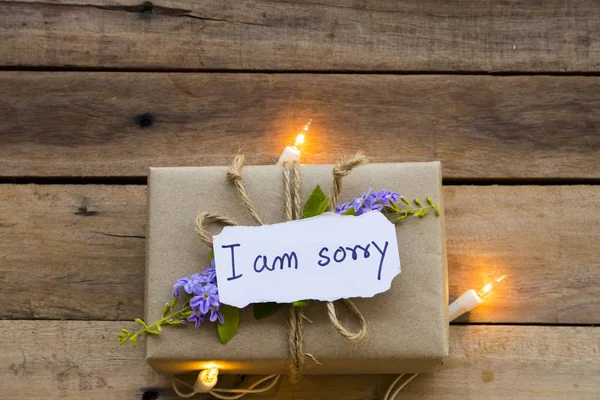 Tut Mir Leid Nachricht Karte Handschrift Mit Geschenkbox Und Licht — Stockfoto