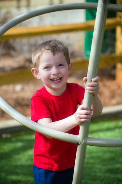 Cute Young Boy Playing Playground Stock Picture