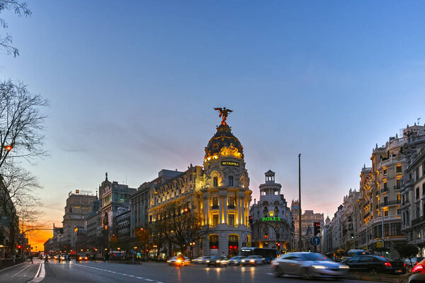 MADRID, SPAIN - JANUARY 23, 2018: Sunset view of Gran Via and Metropolis Building (Edificio Metropolis) in City of Madrid, Spain