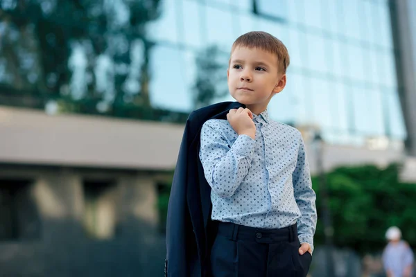 School boy posing in formal wear, elegant clothes