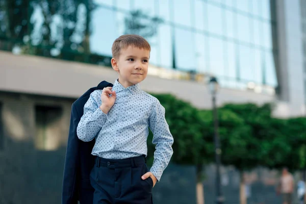 School boy posing in formal wear, elegant clothes