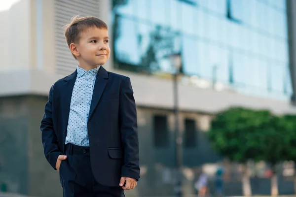 Portrait boy in classic dark blue business suit — Stok Foto