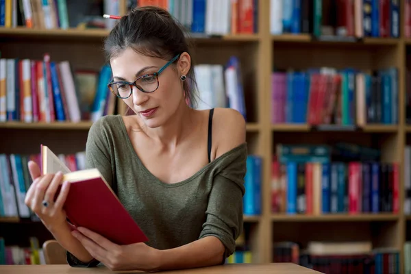 Young beautiful woman reading inspired book — Stock Photo, Image