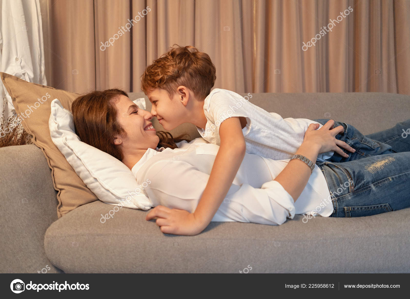 Mother Son Lying Sofa While Hugging Each Other Lazy Day Stock Photo by  ©diignat 225958612