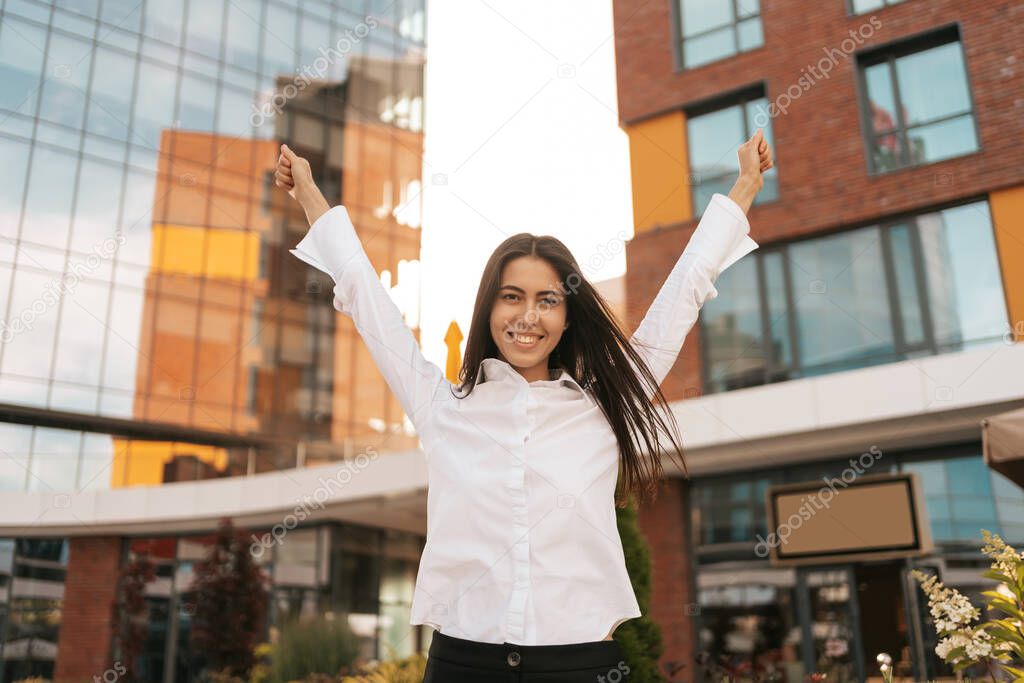 Rearview of businesswoman enjoying her great results