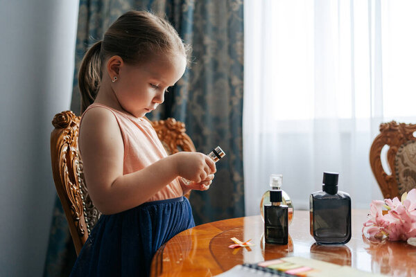 Little girl dreams to become a perfumer