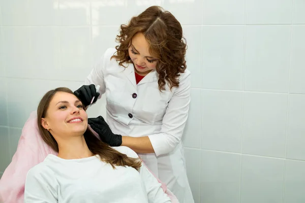 beautiful young girl at a reception at a beautician in a beauty salon