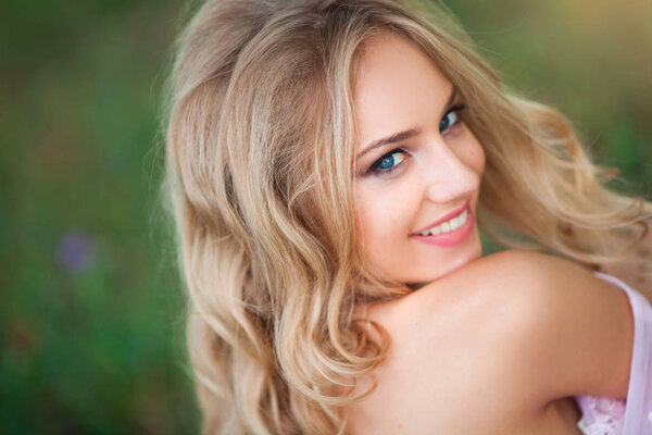 portrait of a beautiful young woman with makeup and hairdo