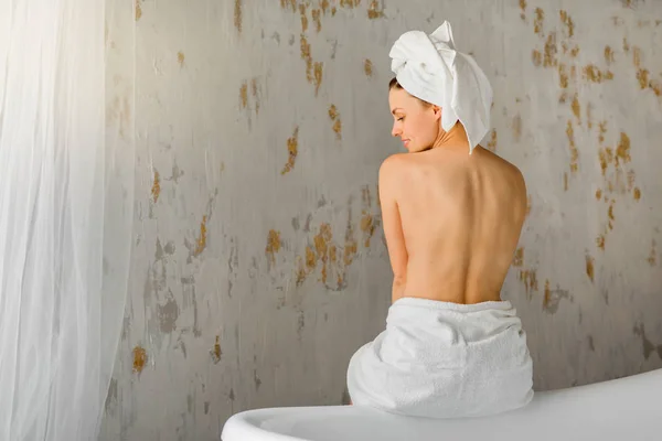 Beautiful Young Woman White Towel Her Head Sits Her Back — Stock Photo, Image