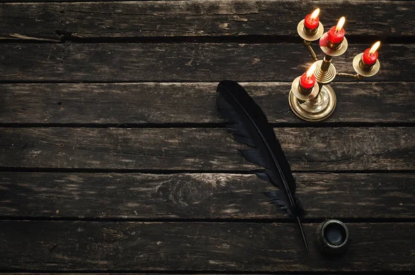 Old Candlestick Four Burning Candles Feather Pen Inkwell Aged Wooden — Stock Photo, Image