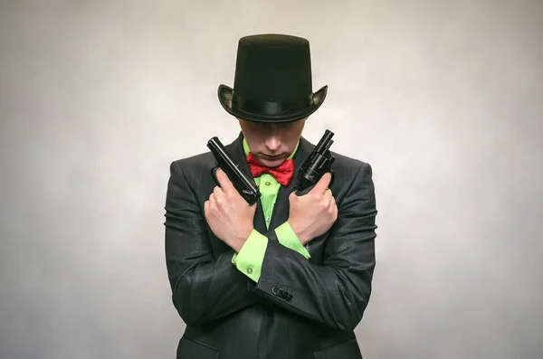 The spy. Secret service. Detecive agent holds pistol gun in his hands and aiming. Retro gangster isolated on white background.