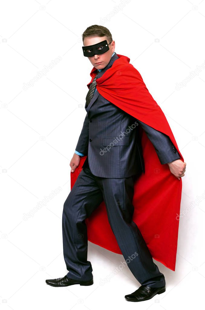 Super hero man sneaks and looks around isolated on white background.