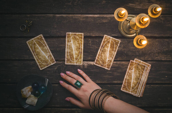 Tarot cards on fortune teller desk table background. Futune reading concept. Divination.