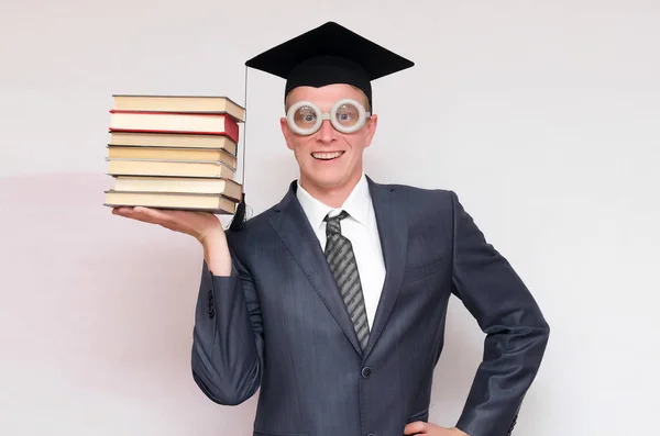 Heureux Étudiant Diplômé Avec Des Livres Isolés Sur Fond Gris — Photo