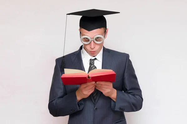 Offended Graduate Student Reading Books Isolated Gray Background Education Concept — Stock Photo, Image